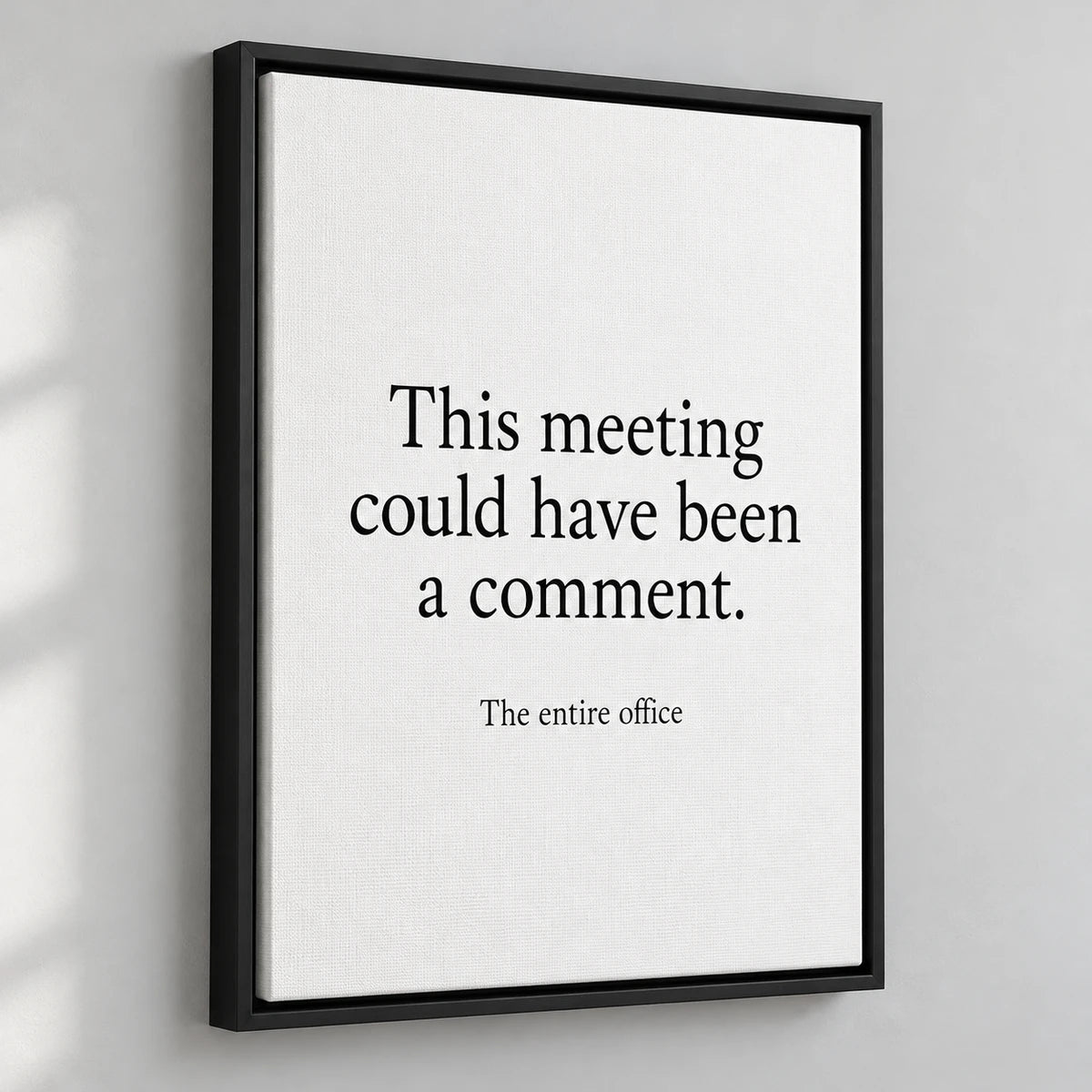 AI-generated illustrative mockup of a black floating-frame canvas with the quote: This meeting could have been a comment.